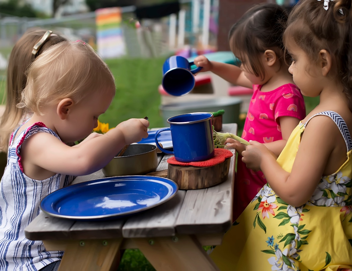 Children learning through play in Kinderberry Hill's outdoor classroom